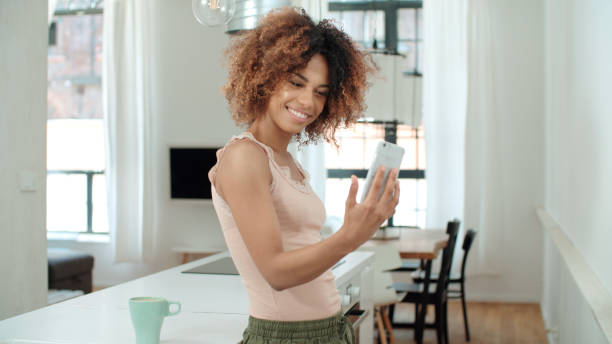 istock Attractive young black woman making selfie in the kitchen. 1010059320