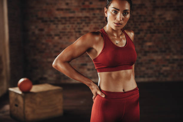 istock Woman standing after workout at gym 1010060230