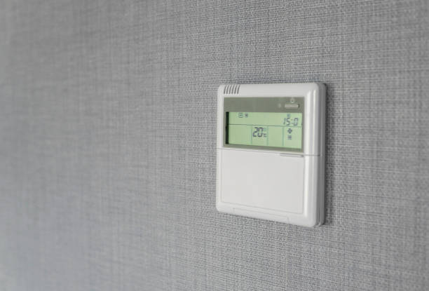 istock Wall display shows air temperature inside the apartment room. Smart home automation. Showing household consumptions related to temperature and heating. 1010068080