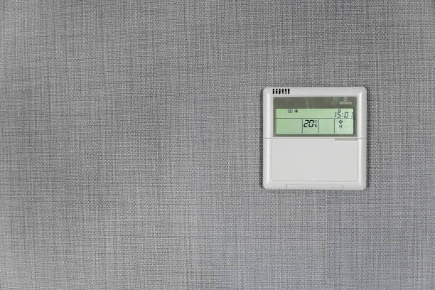 istock Wall display shows air temperature inside the apartment room. Smart home automation. Showing household consumptions related to temperature and heating. 1010068260