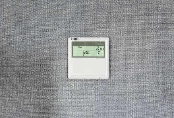 istock Wall display shows air temperature inside the apartment room. Smart home automation. Showing household consumptions related to temperature and heating. 1010068408