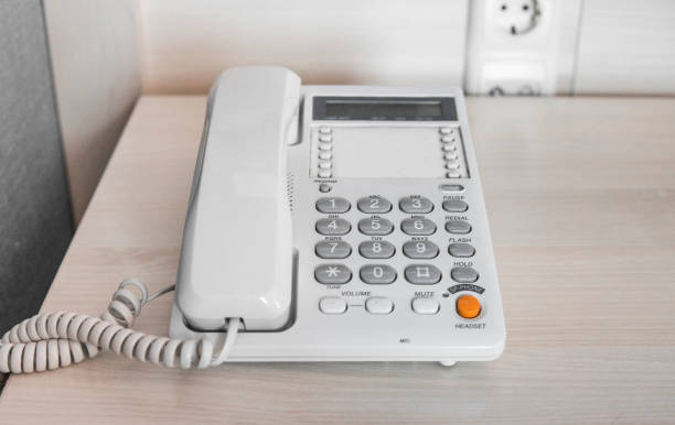 istock White telephone on table in hotel room. 1010068756
