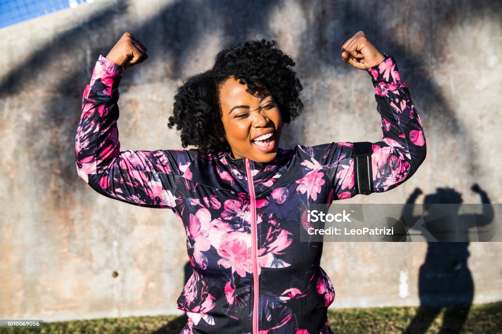 Funny portrait of a young black curvy woman during a training session Women Stock Photo