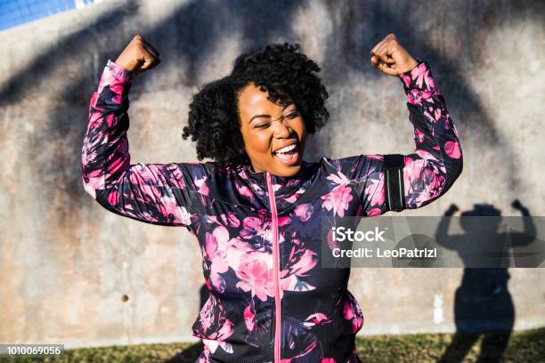 Funny Portrait Of A Young Black Curvy Woman During A Training Session Stock Photo - Download Image Now