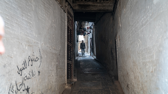 Fez, Morocco - April 2018: Anonymous man in the street of Medina of Fez, Morocco.