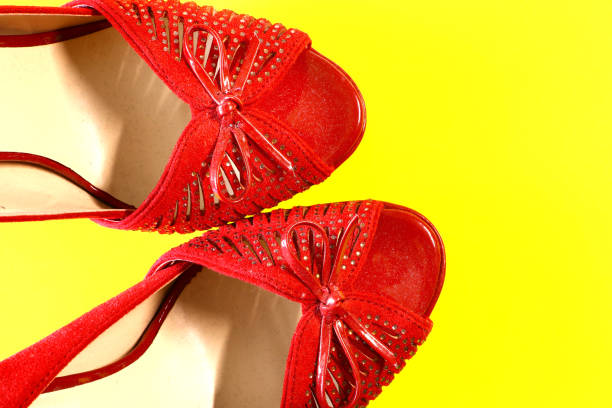 istock women's red shoes on a yellow background 1010079852
