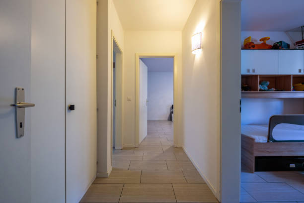 istock White corridor with built-in closets and open doors 1010083432
