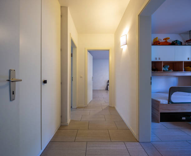 istock White corridor with built-in closets and open doors 1010083454