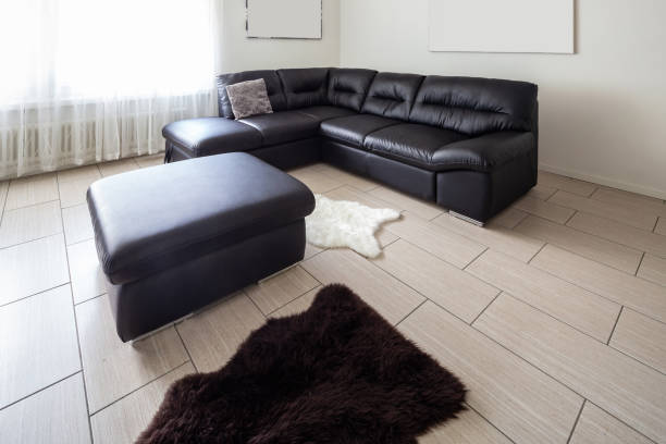 istock Living room with leather sofa and white walls 1010083680