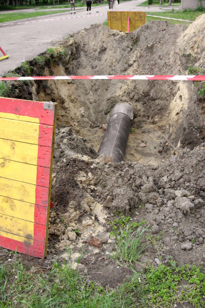 istock dug hole for sewage pipe, restricted area, traffic restriction 1010084244
