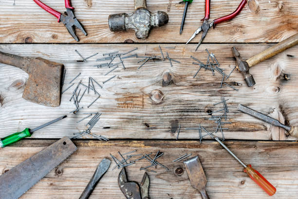 istock Collection of vintage woodworking tools on a rough workbench and blank copy space. 1010092526