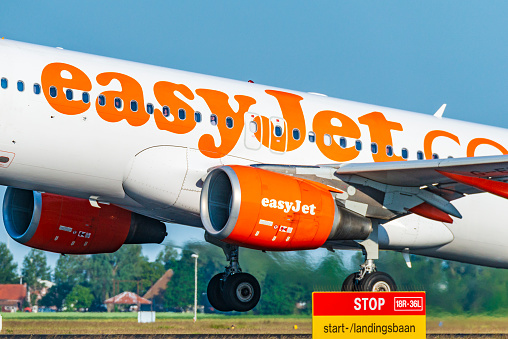 EasyJet Airbus A319-111 taking off from Amsterdam Airport Schiphol from the Polderbaan during a day with clear weather.
