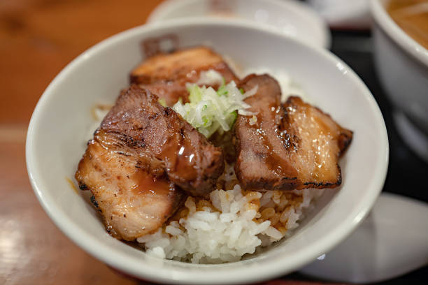 istock Japanese style cooked pork and rice with green onion 1010093122