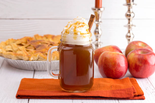 Hot Caramel Apple Cider with an Apple Pie and Cinnamon Stick Hot Caramel Apple Cider with an Apple Pie and Cinnamon Stick apple juice photos stock pictures, royalty-free photos & images