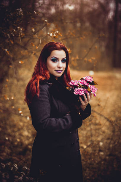 istock Goth girl with bouquet 1010109564