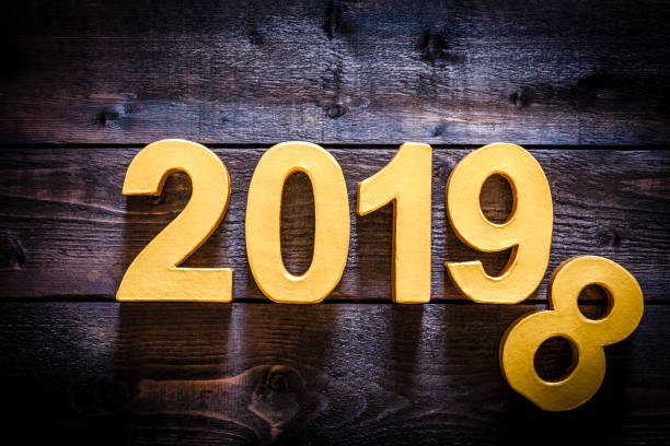 istock Year 2019 golden numbers on a wooden plank with copy space 1010115968