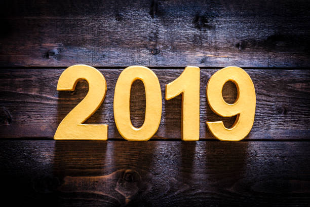 istock Year 2019 golden numbers on a wooden plank with copy space 1010115974