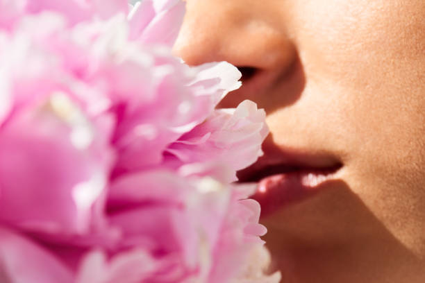 istock Girl Smelling Flower 1010120236