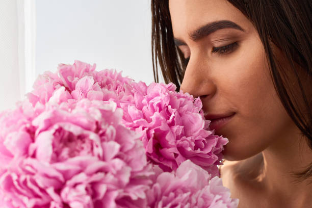 istock Girl Smelling Fresh Flowers 1010123456