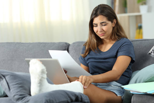 istock Sad disabled woman working at home 1010132580