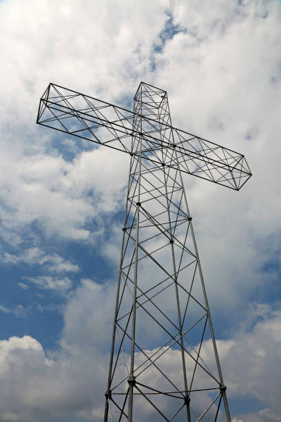 istock big cross with white clouds on the sky 1010142324