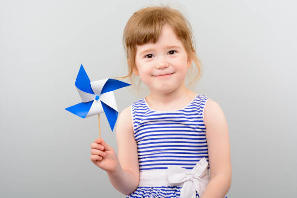 istock Cute girl with windmill toy 1010142844
