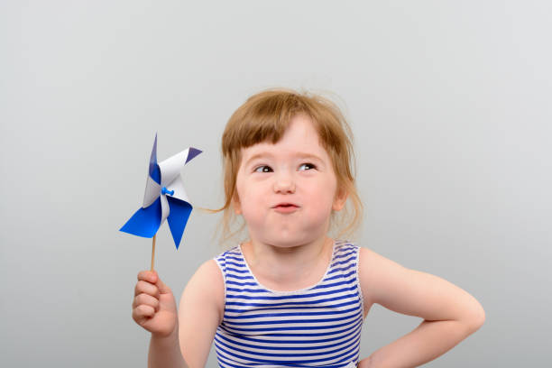 istock Cute girl with windmill toy 1010142846