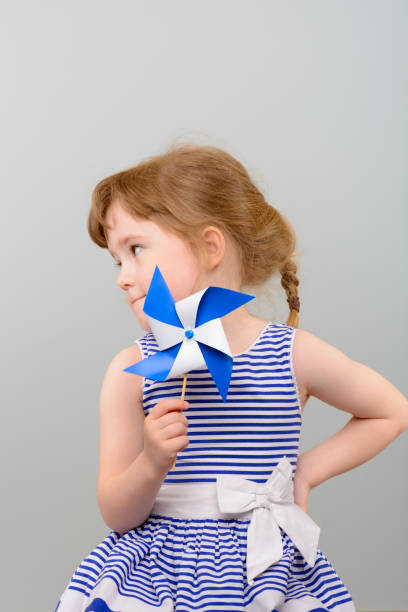 istock Cute girl with windmill toy 1010142852