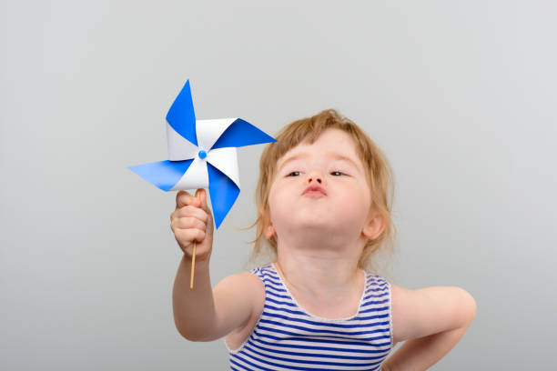 istock Cute girl with windmill toy 1010142854