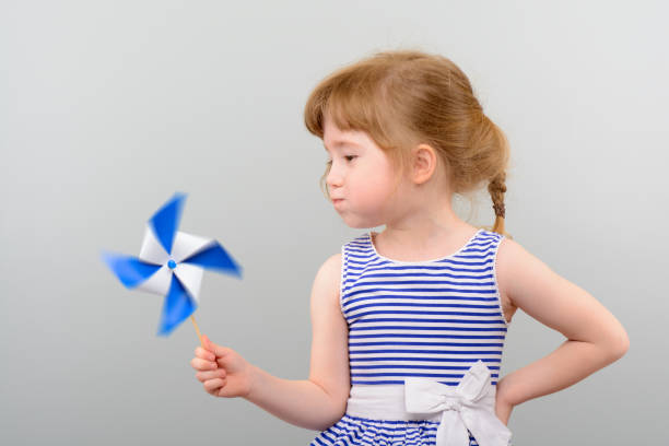 istock Cute girl with windmill toy 1010142862