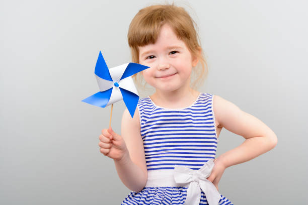 istock Cute girl with windmill toy 1010142864