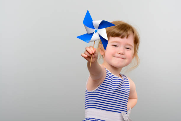 istock Cute girl with windmill toy 1010142878