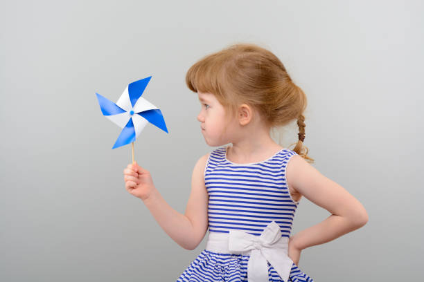 istock Cute girl with windmill toy 1010142892