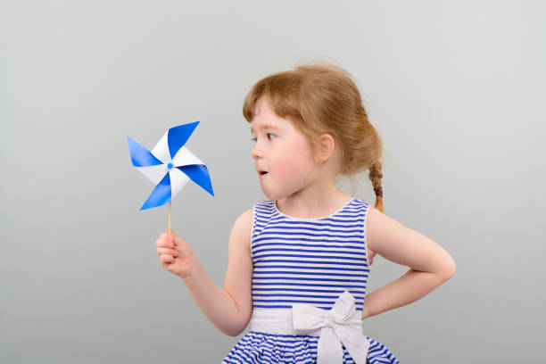 istock Cute girl with windmill toy 1010142904