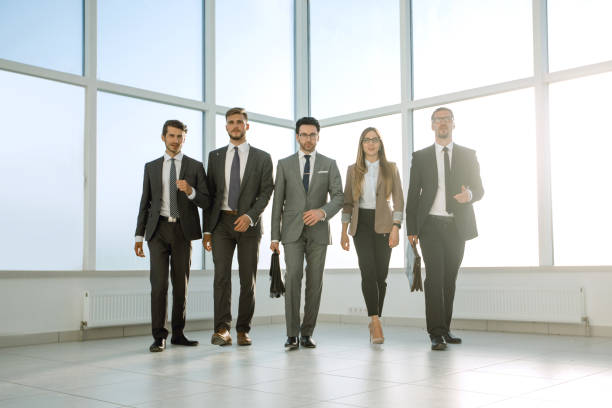 istock Business people walking in the office corridor 1010143080