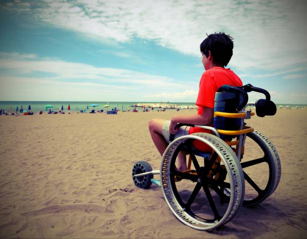 boy on the special wheelchair with aluminum alloy wheels with vi - esclerose lateral amiotrófica imagens e fotografias de stock