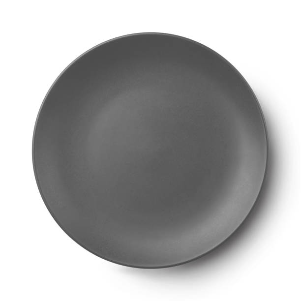 istock Simple circular porcelain plate isolated on white and shadow. 1010145342
