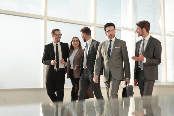 istock Businesspeople walking in the office background 1010145996