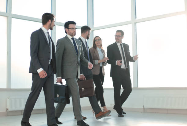 istock Businesspeople walking in the office background 1010146152