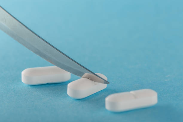 istock to divide the tablet with a knife into two parts 1010149460