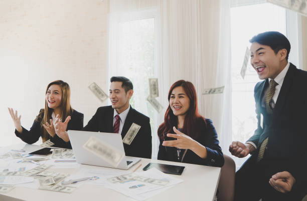 istock Business team and partner is celebrating by throwing money 1010154728