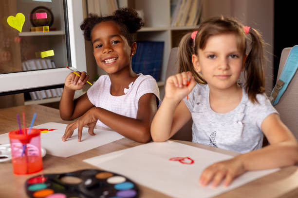 istock Girls having fun painting 1010154798