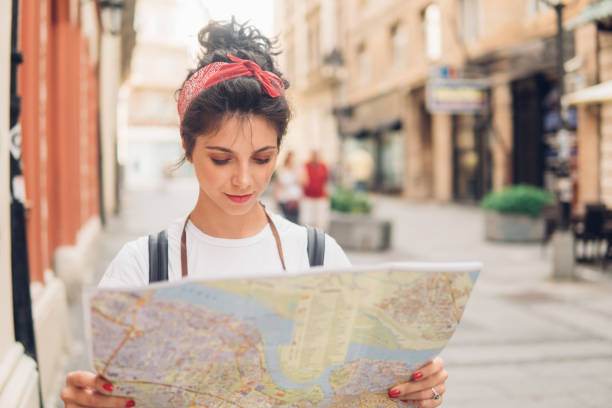 istock Young girl with the map 1010160778