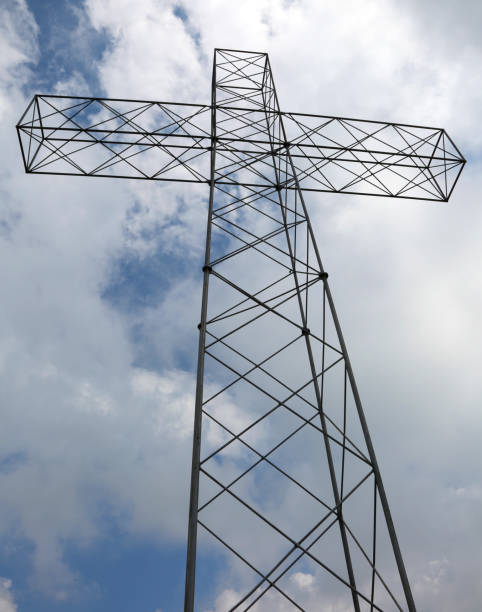 istock cross in vertical and white clouds on the sky 1010160950