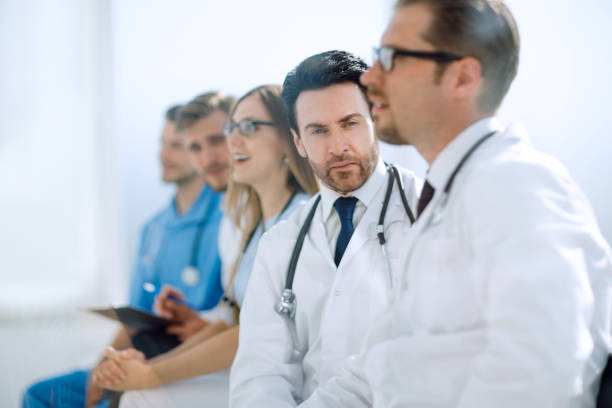 istock Male doctor with colleagues 1010161040