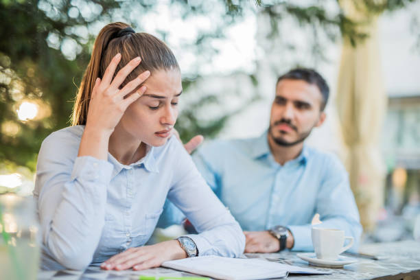 istock She can't decide whether work or her boyfriend irritates her more. 1010166410