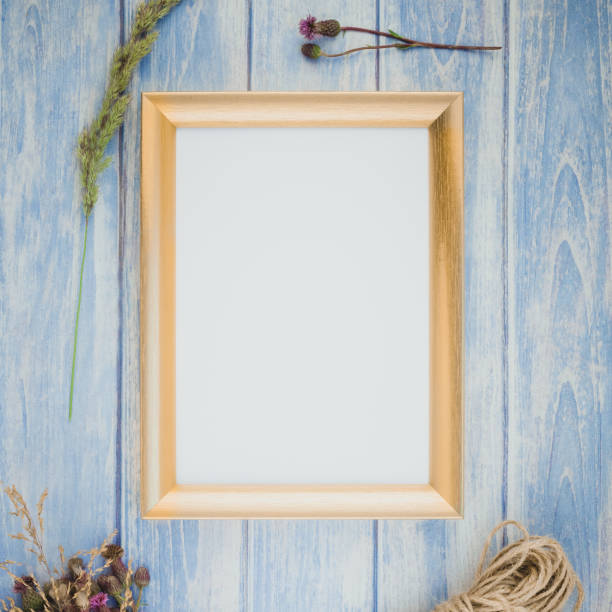istock Golden frame mock up with autumn flowers 1010169212