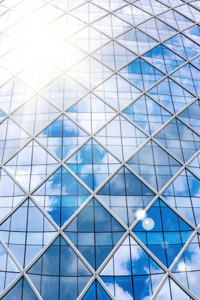 istock Blue sky reflecting in windows of office building 1010169350