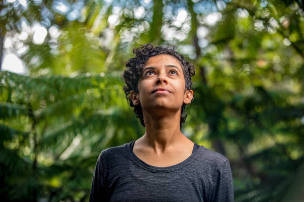 istock Serene Woman in Lush Outdoor Setting 1010173062