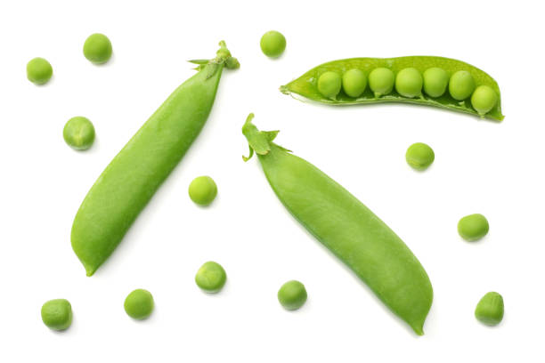 istock fresh green peas isolated on a white background. top view 1010180308
